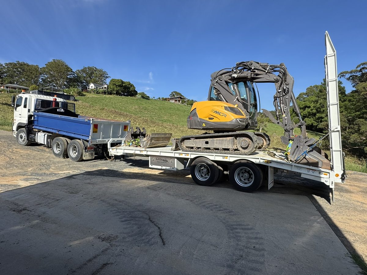Hino 700 tipper truck with beavertail trailer