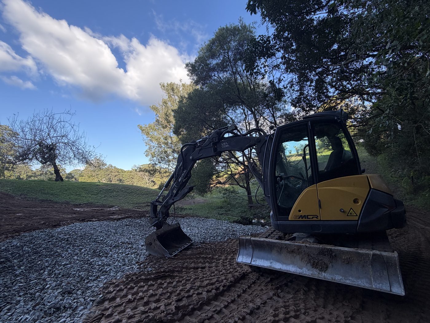 Mecalac 6MCR spreading gravel base on a driveway, Yarraman Rd Sawtell